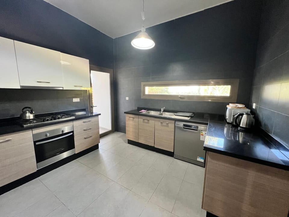 Fully equipped modern kitchen with all essentials for home cooking
