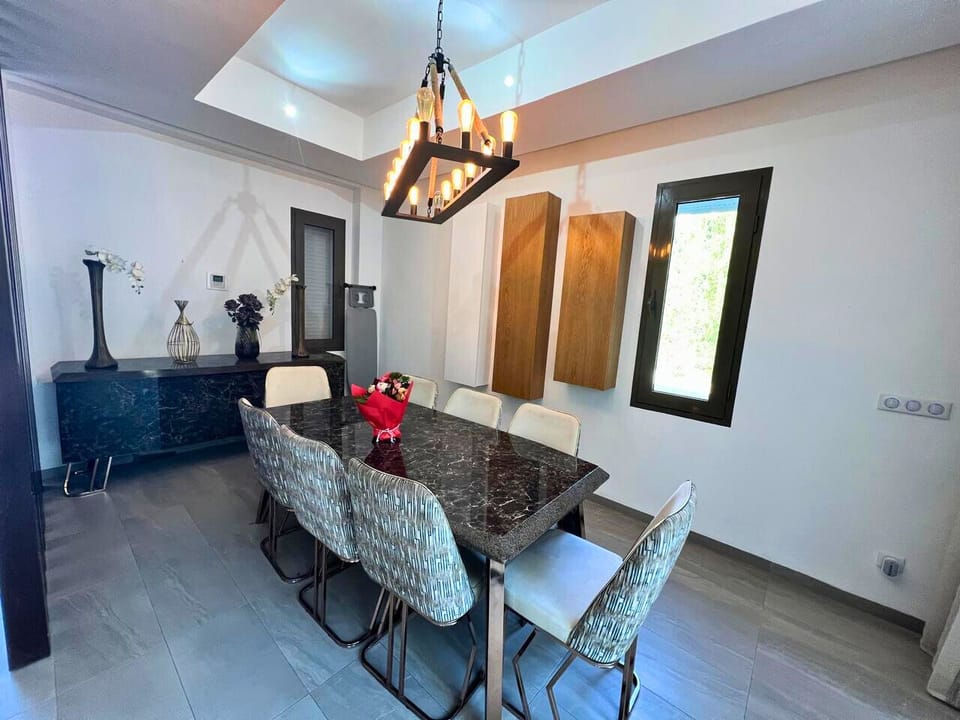 elegant dining area with modern decor, ideal for sharing moments together. 