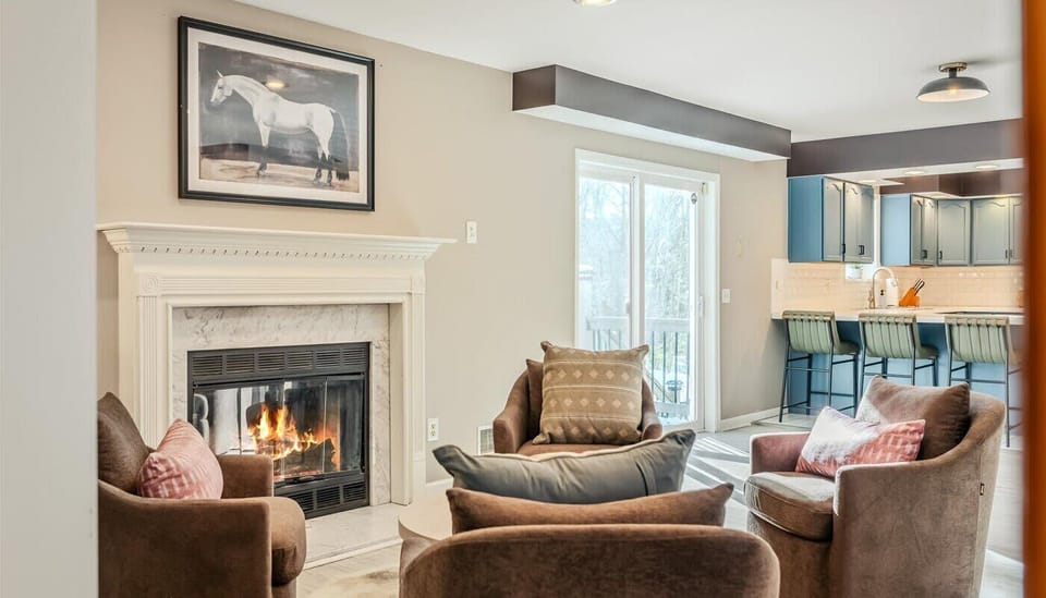 Comfy seating? Check. Warm, glowing fireplace? Check. Endless cozy vibes? Double check. Curl up, sip something warm, and let the evening magic happen.