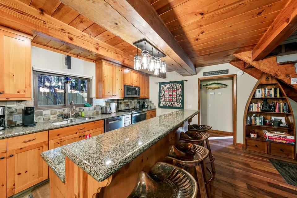 Rustic kitchen with granite island and cozy seating