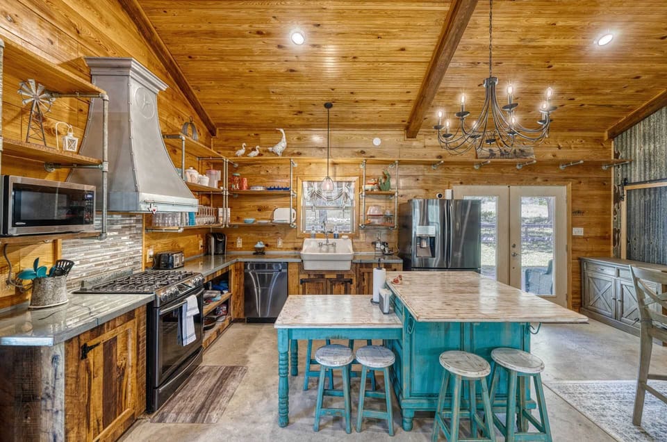 A fully equipped farmhouse kitchen with rustic charm-perfect for cooking, gathering, and sharing meals