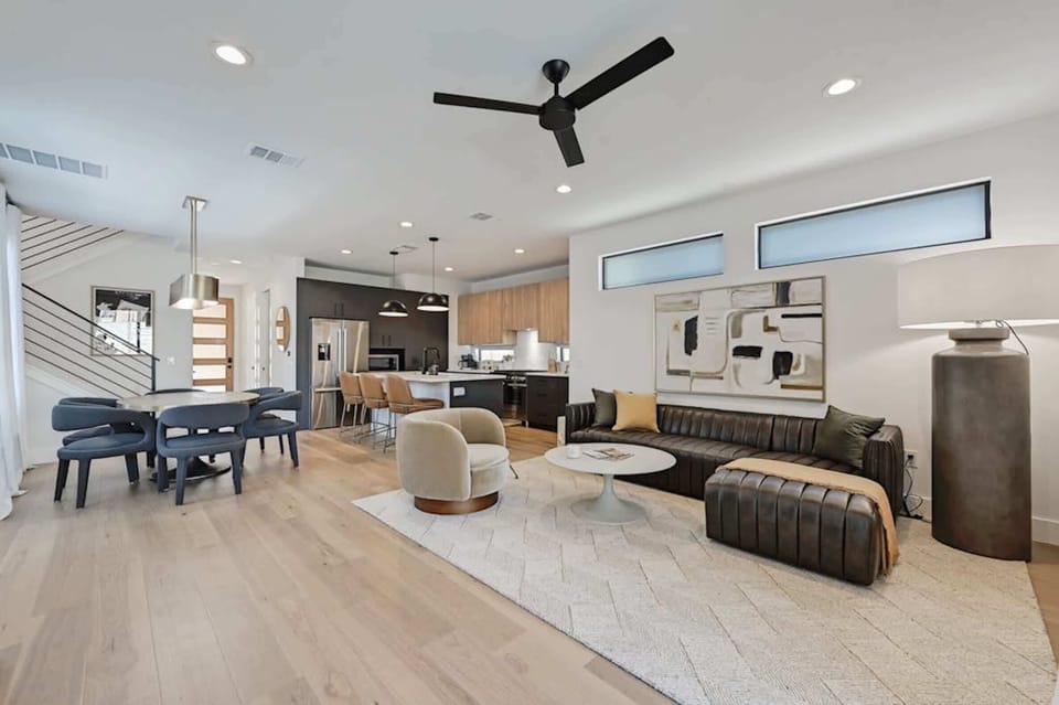 Open-concept living room w/a smart TV and patio access
