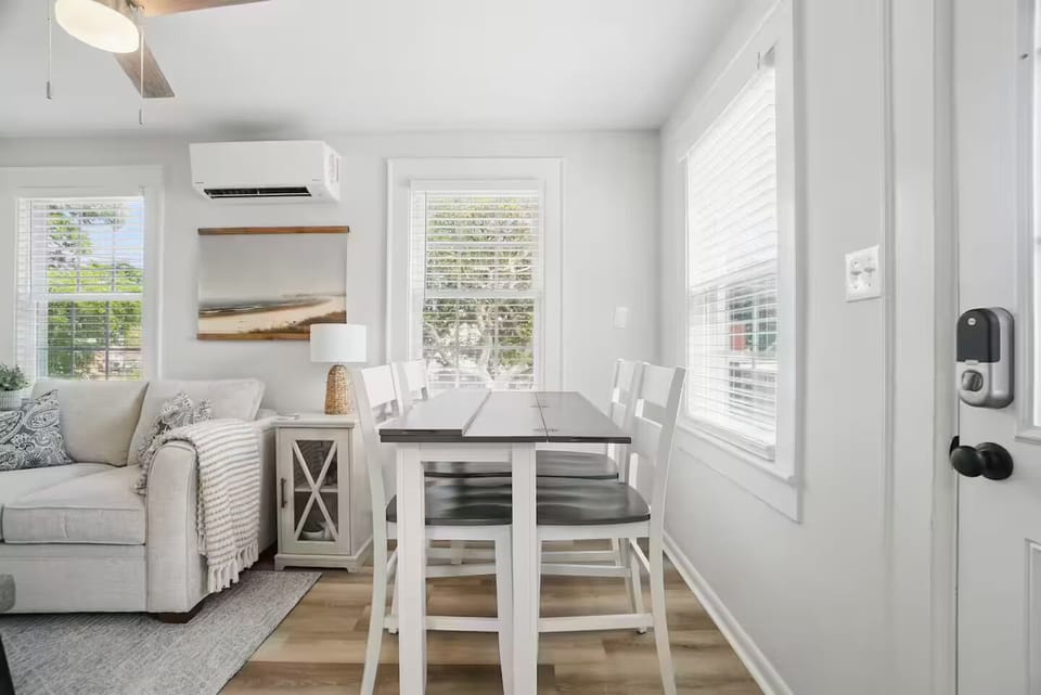 Gather here for slow breakfasts, beach-day planning, or cozy dinners.