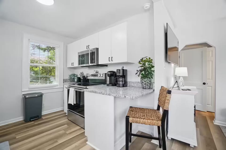 Enjoy a fully equipped kitchen and cozy breakfast bar—perfect for easy meals 