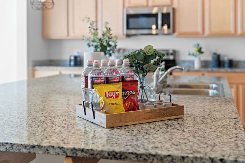 Enjoy the complimentary bottled Arrowhead water, snacks & coffee pods!