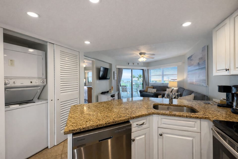 Fully equipped kitchen with appliances, utensils, cookware and two coffee makers