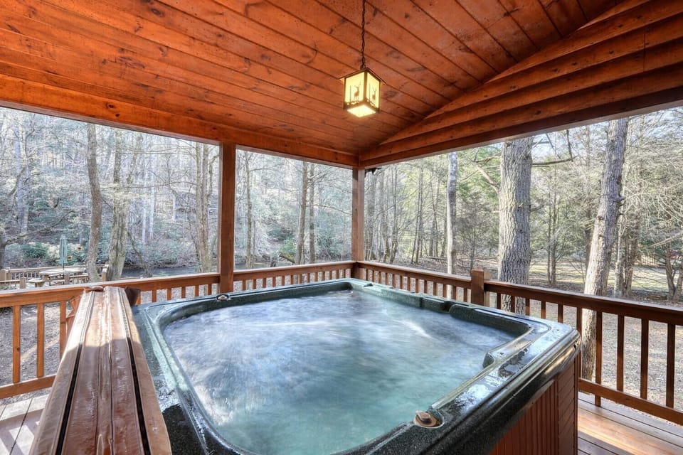 Enjoy forest views, a private hot tub, and cozy cabin elegance.