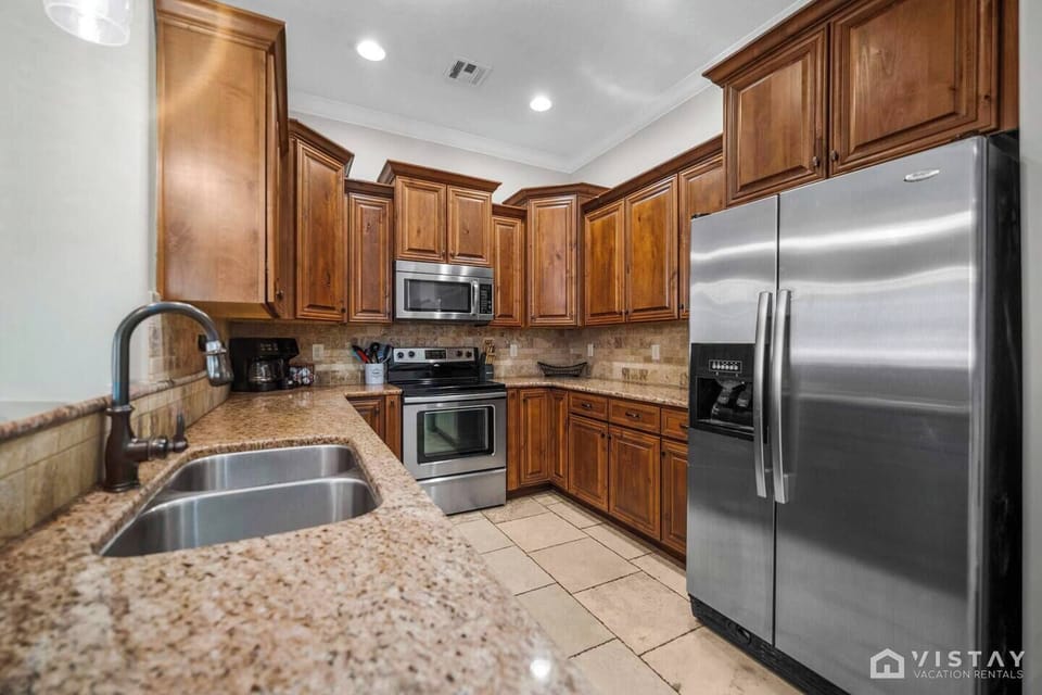 Well-equipped kitchen with stove, oven, dishwasher, and coffee maker