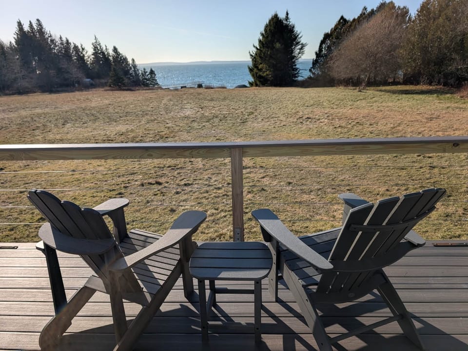 Adirondack chairs on the back deck to enjoy sunset