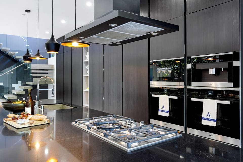 The kitchen is fully stocked with reliable appliances and utensils.