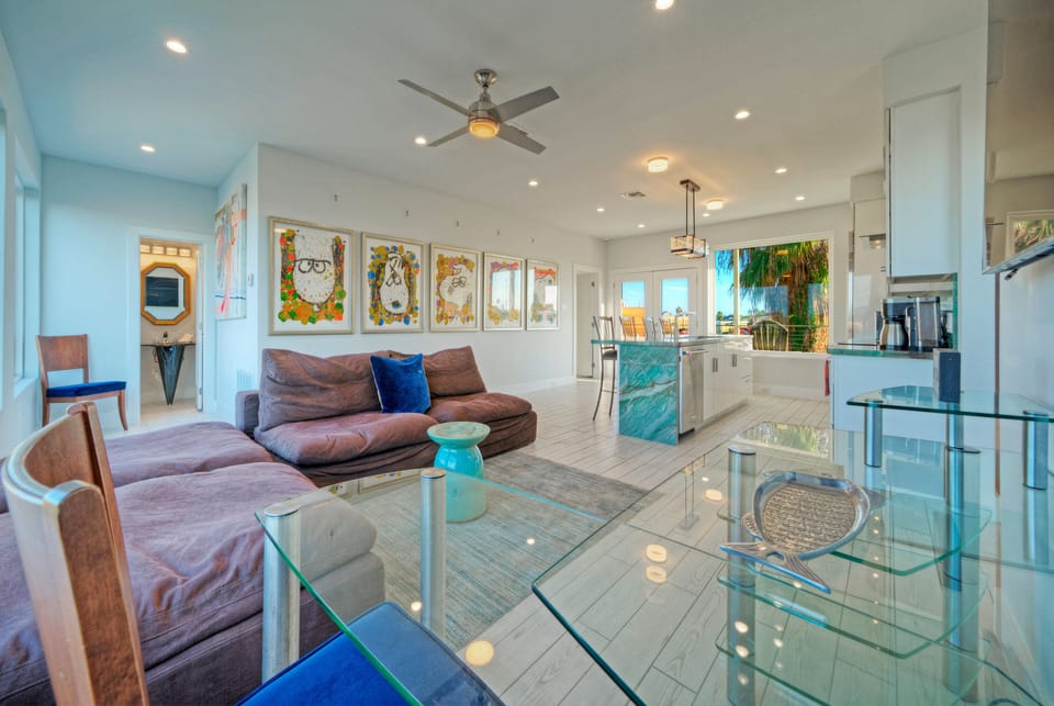 Playful, modern artwork adds a pop of color and personality to the bright living space.