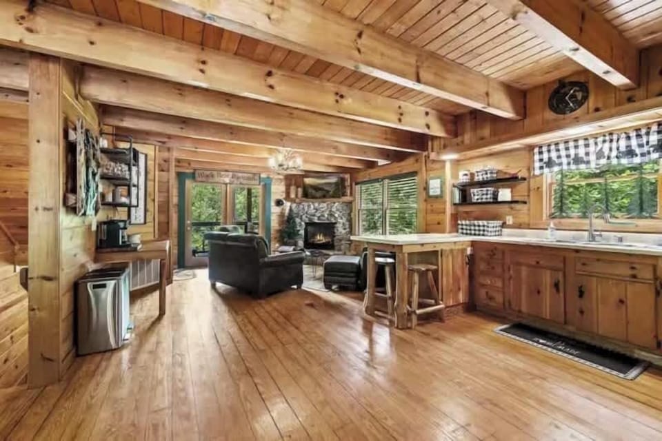 Living area flows seamlessly into kitchen and dining.
