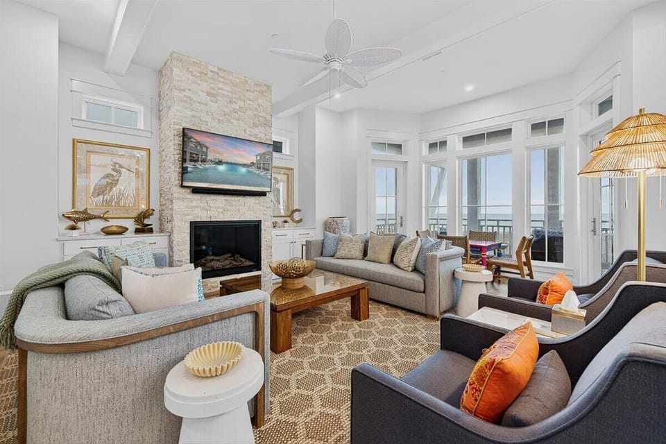 Primary Living Room, 3rd Floor - Featuring a fireplace and Gulf views.