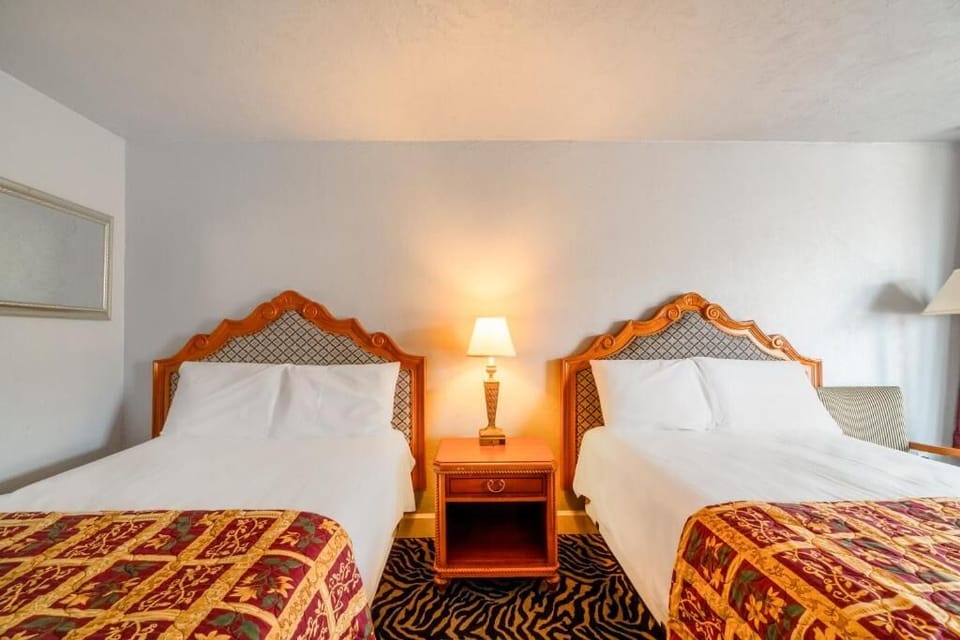 Drift off comfortably with soft linens and bedside glow.