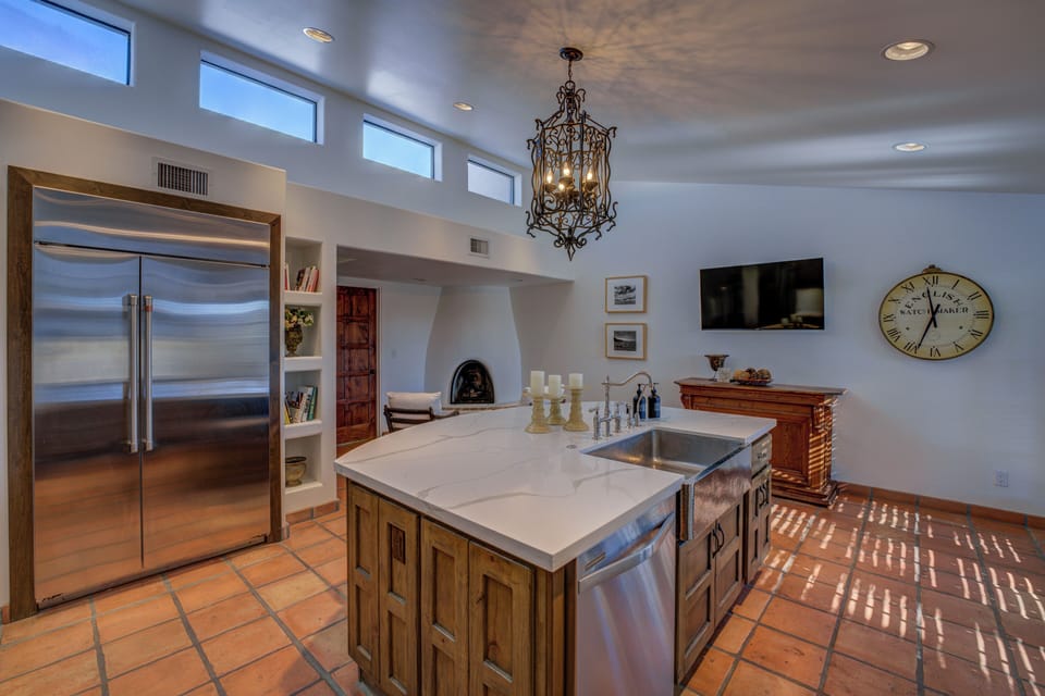 There's a large refrigerator, double ovens, and a 12-foot ceiling.