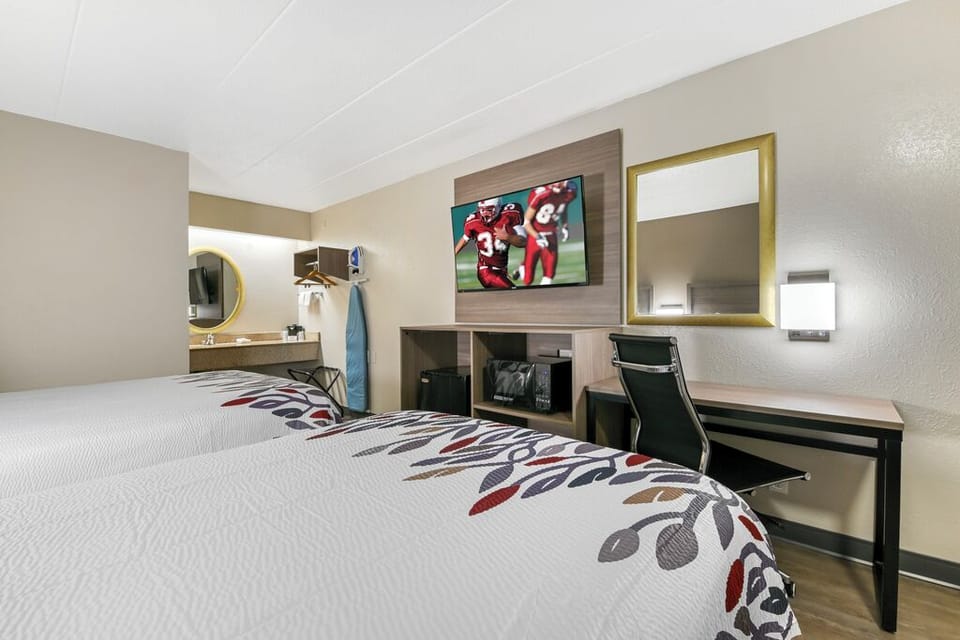 Kick back with in-room TV and an easy work desk.