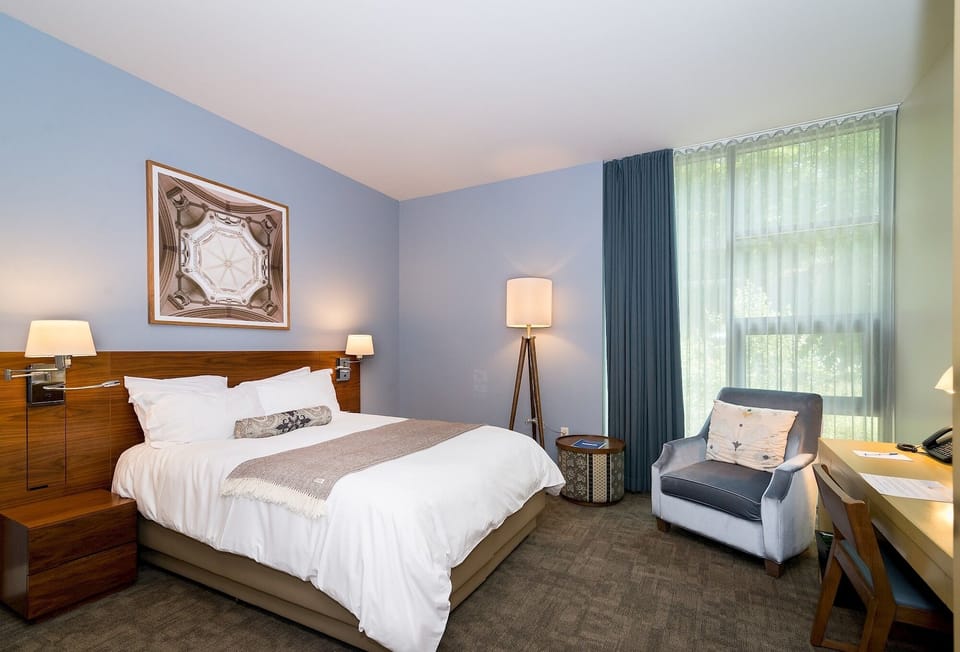 Settle into a bright room with lounge chair and views.