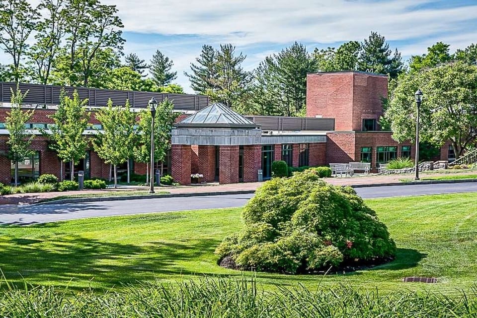 Discover peaceful grounds framed by greenery and classic brickwork.