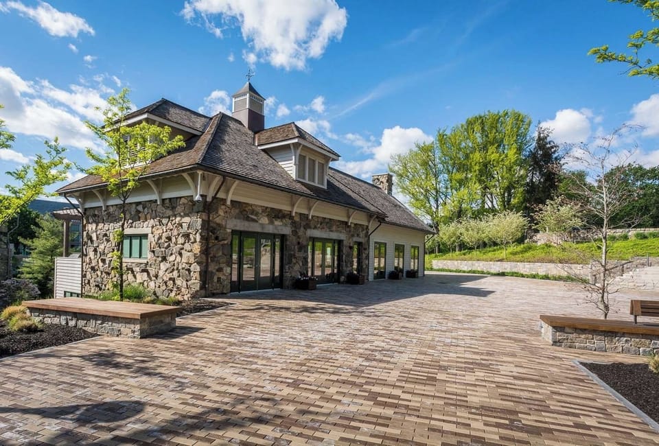 Step into a charming stone lodge with sunlit terrace vibes.