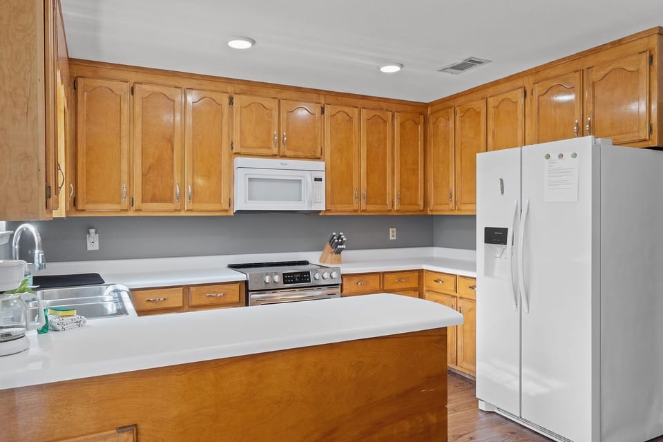 Cook with ease in this bright kitchen with ample counter space and all the essentials.