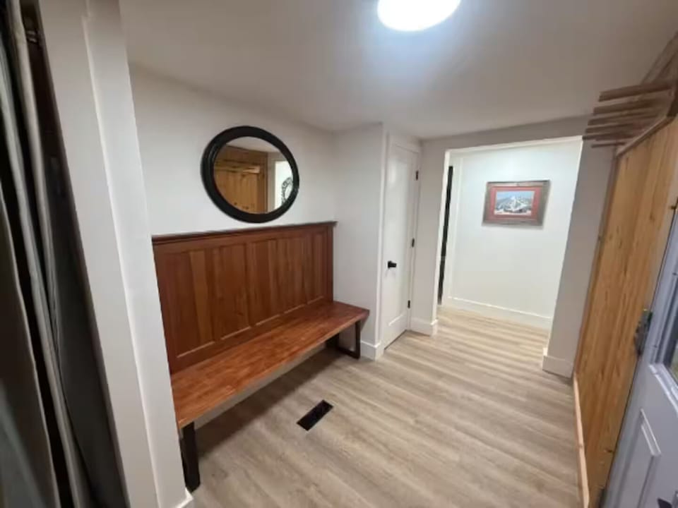 Ample mudroom entry to hang all your ski gear. New washer and dryer here also.