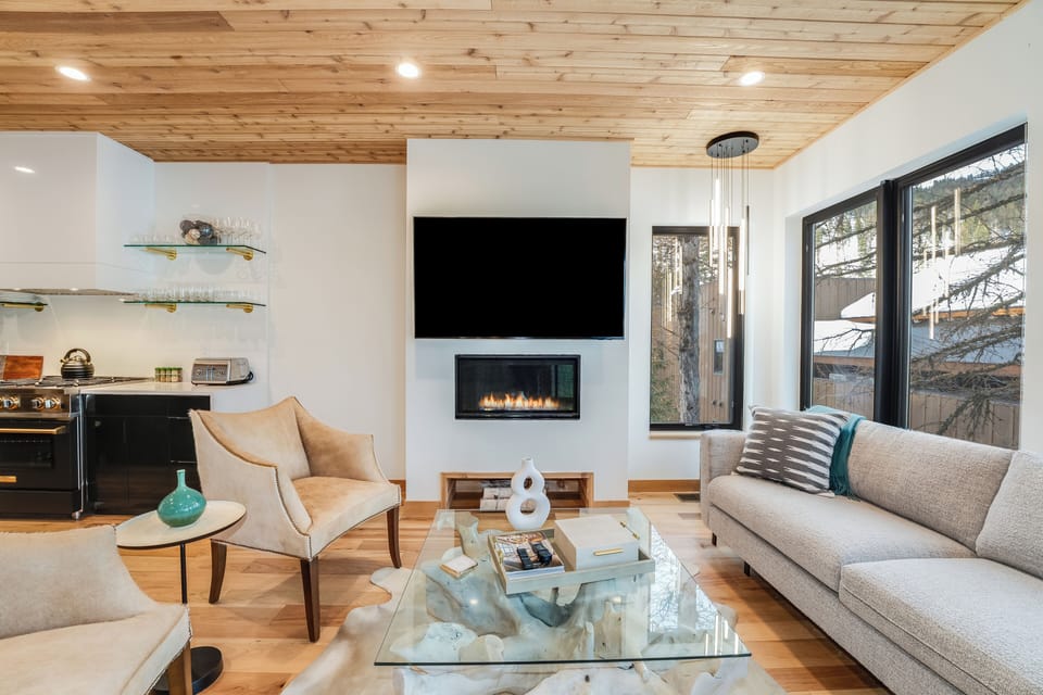 Living room with a gas fireplace. | Main Level