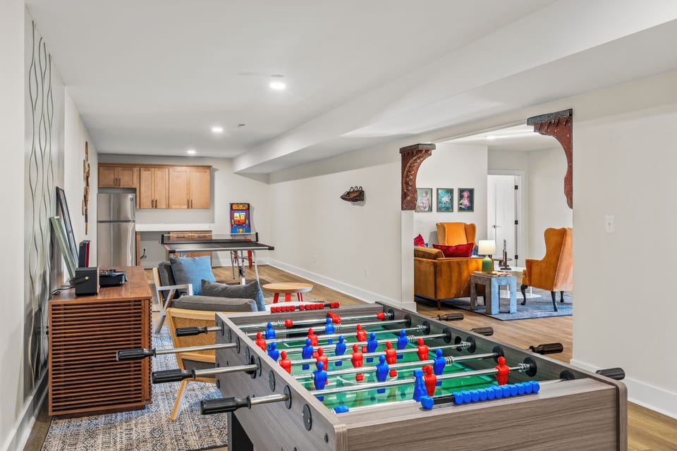 Entertainment area with foosball, ping pong table, and arcade game