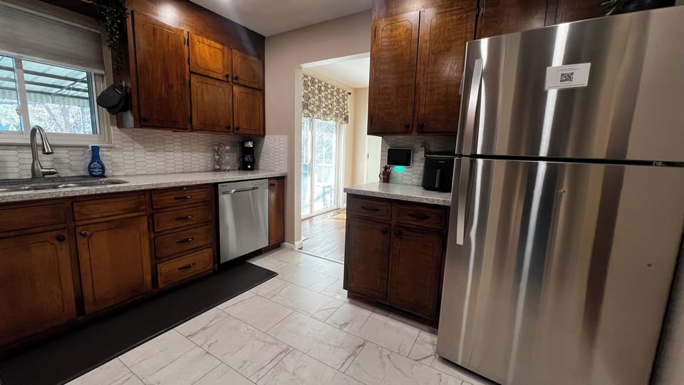 Alternate kitchen view showing the open flow to the dining area.