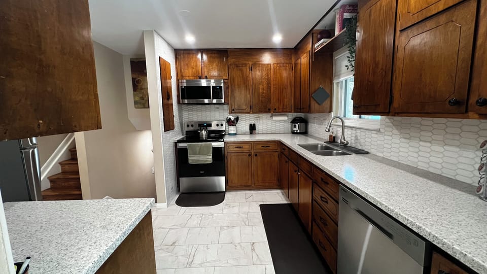 Well-equipped kitchen with modern appliances/full cookware for extended stays.