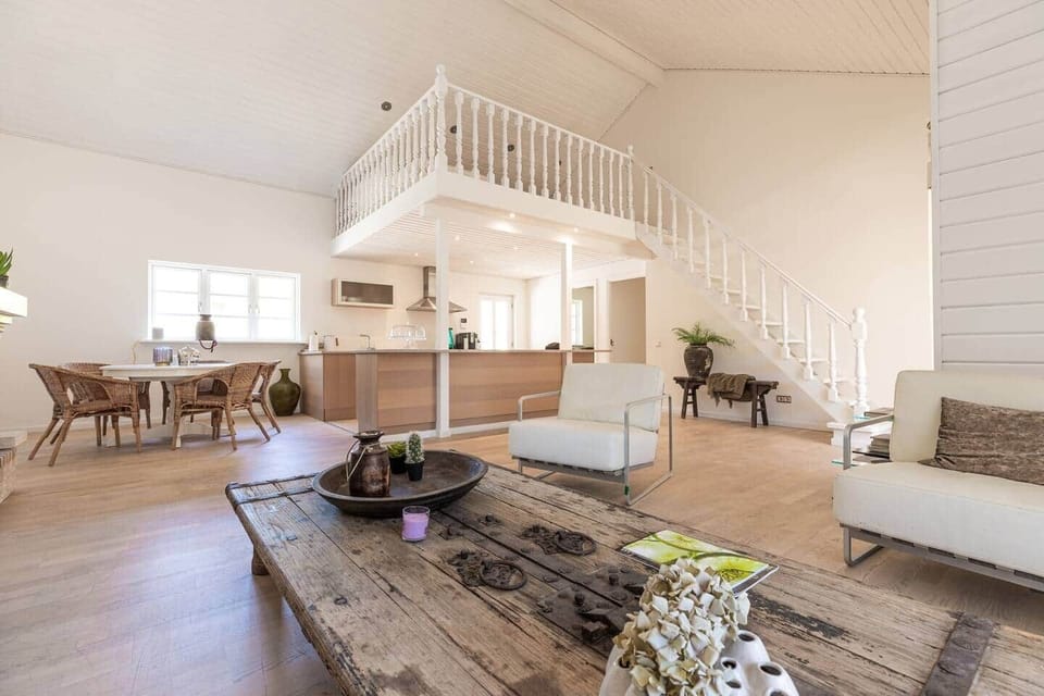 Casalot spacious open-plan interior with high ceiling and boho decor in Almancil Algarve country hou