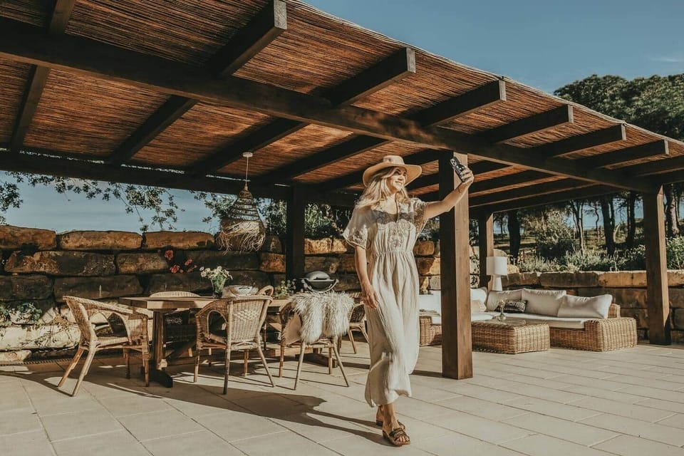 Casalot pergola walkway and cabana with woman walking in country house Algarve