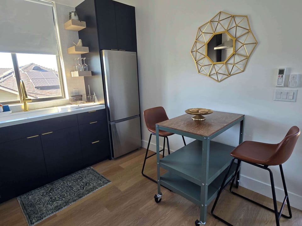 Bright kitchen with full appliances and dining nook