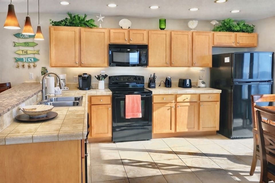Fully stocked kitchen with bar seating