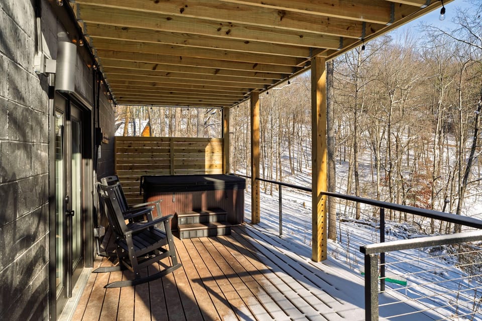 Relax in the private hot tub tucked beneath the deck allowing relaxation in all weatheror gather around the nearby fire pit for cozy evenings and conversation in the fresh air.