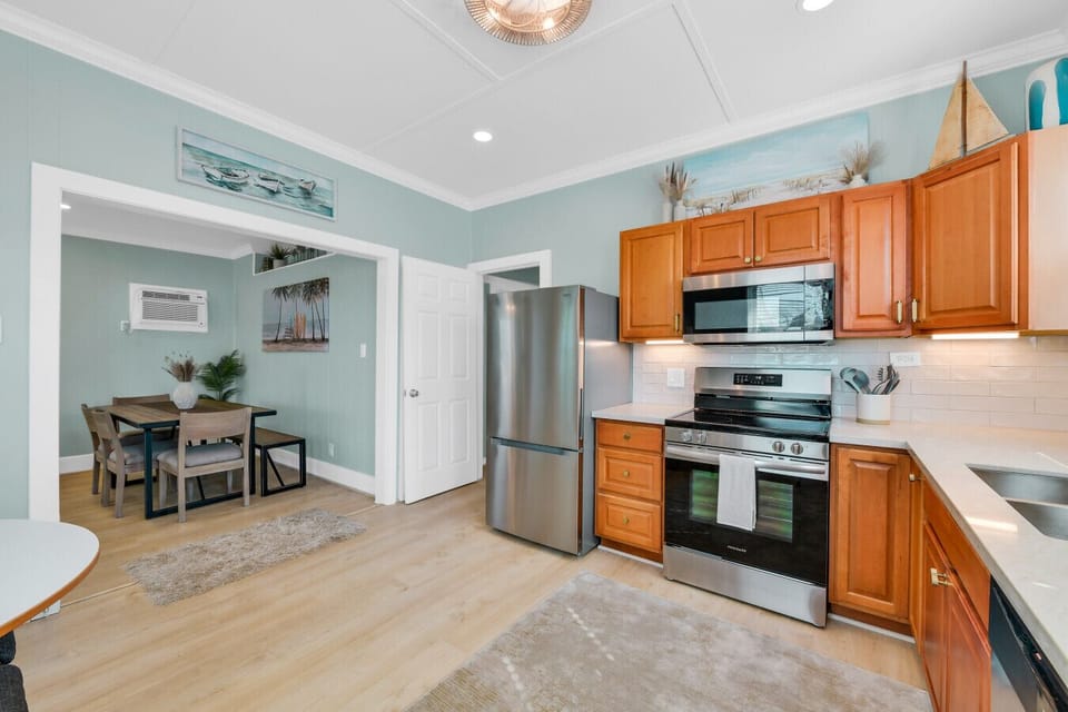 Fully equipped kitchen with stove, oven, dishwasher, and coffee maker