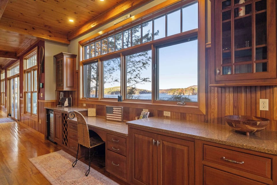 Built-in desk and storage area with a large window overlooking the lake