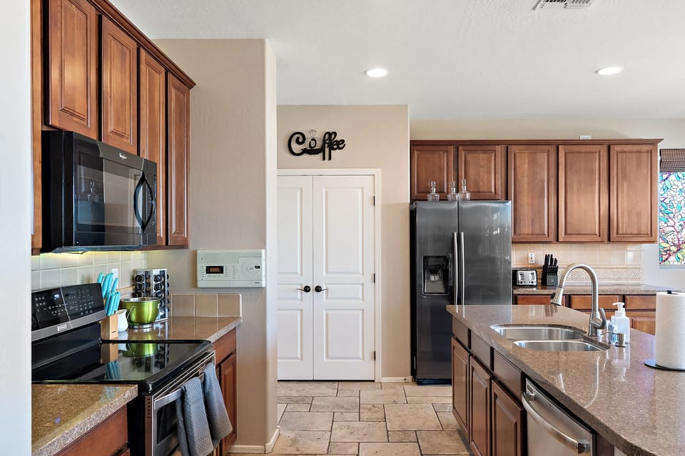 Bright, spacious, and fully equipped, this kitchen makes cooking a joy (or just a stylish backdrop for takeout!).
