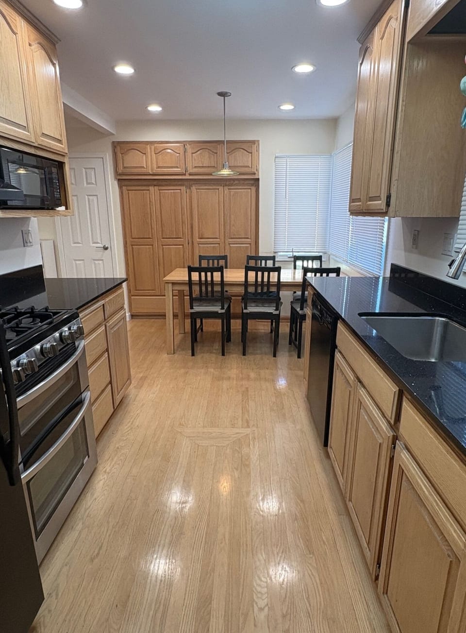 Full kitchen includes a refrigerator, microwave, range, and dishwasher