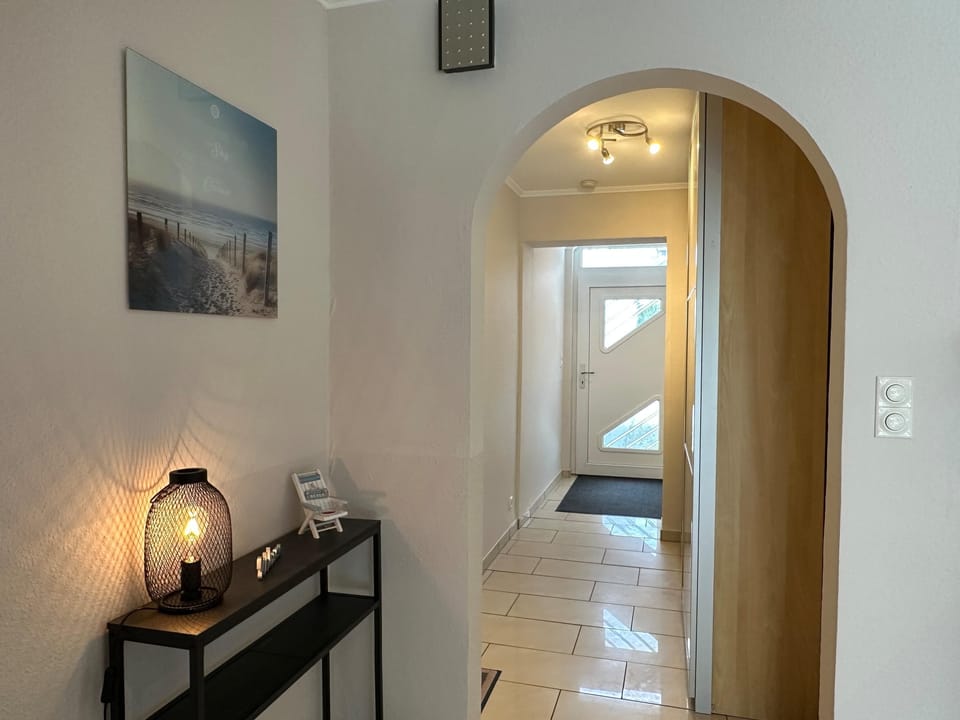 Welcome to the stylish hallway with elegant lighting.