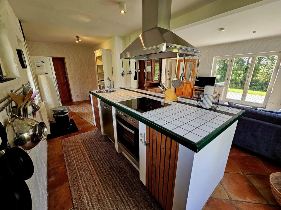 Discover the stylish kitchen, perfect for cooking and enjoying views of nature.