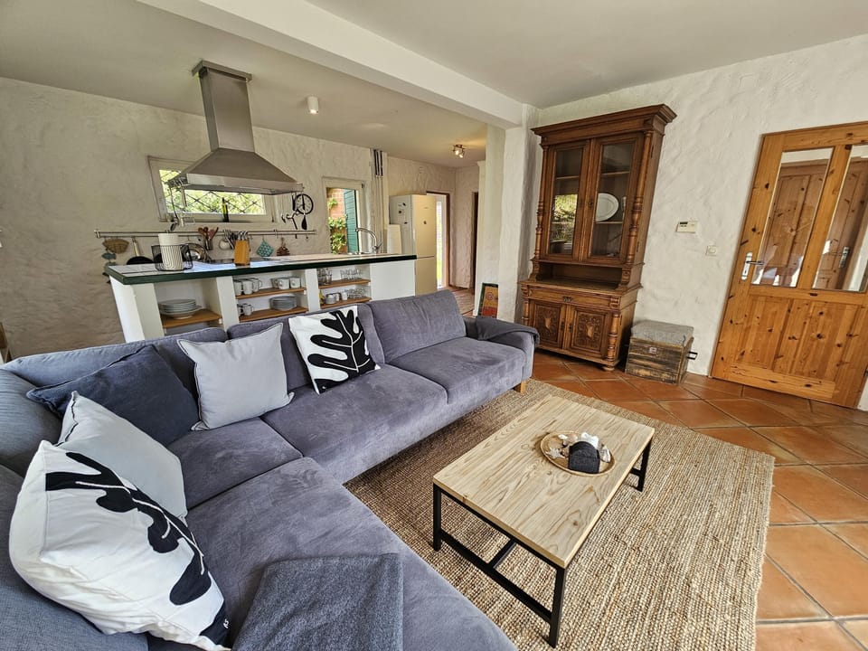 Relax in this stylish living room with modern flair and cozy furnishings.