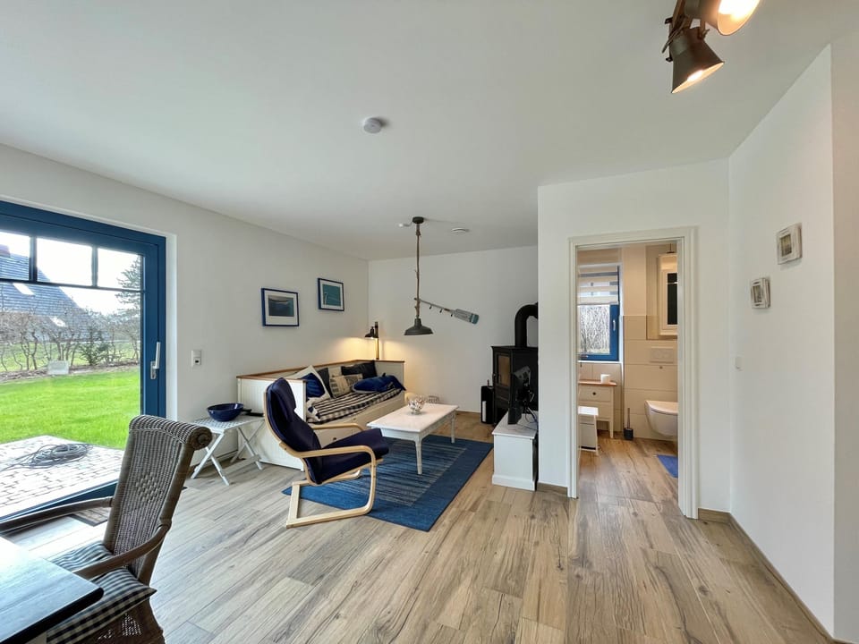 Enjoy relaxing hours in this inviting living area with direct access to the terrace.