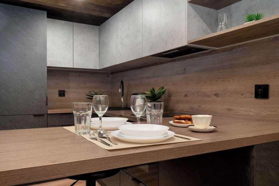 Stylish kitchenette detail with matte finishes and minimalist design.