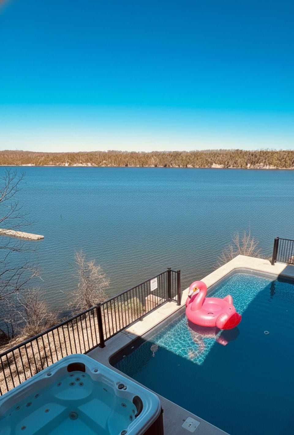 Stunning lakefront getaway with private pool, hot tub, and panoramic water views, perfect for relaxing vacations and luxury waterfront stays.