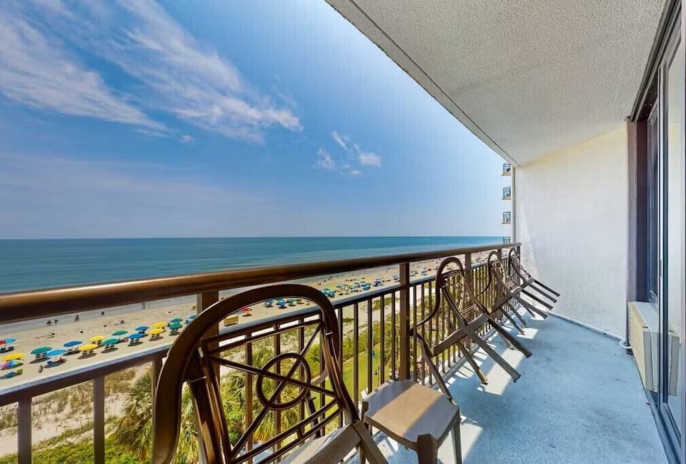 Private balcony with panoramic ocean and beach views