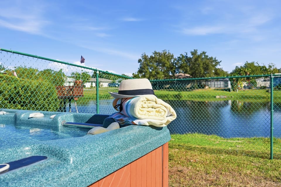 Soak your worries away with a view! 🫧 Our private hot tub overlooks a peaceful lakeside setting, perfect for parent relaxation after a day of family fun. 🌅 Pure bliss in a quiet neighborhood. ✨ #HotTubGoals #Bradenton #FamilyOasis #FloridaLife