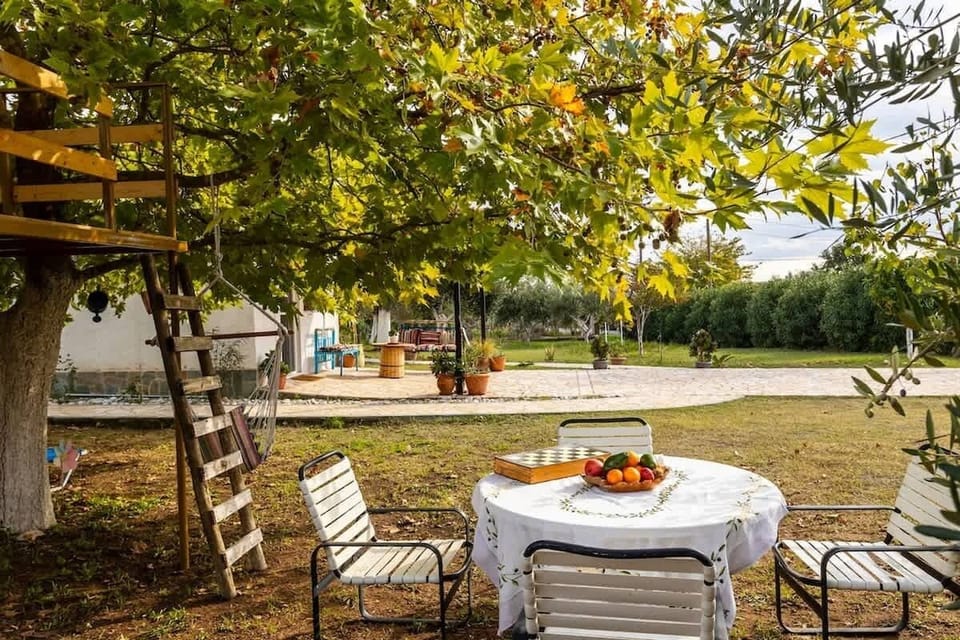 Dine al fresco beneath the trees in your private garden oasis
