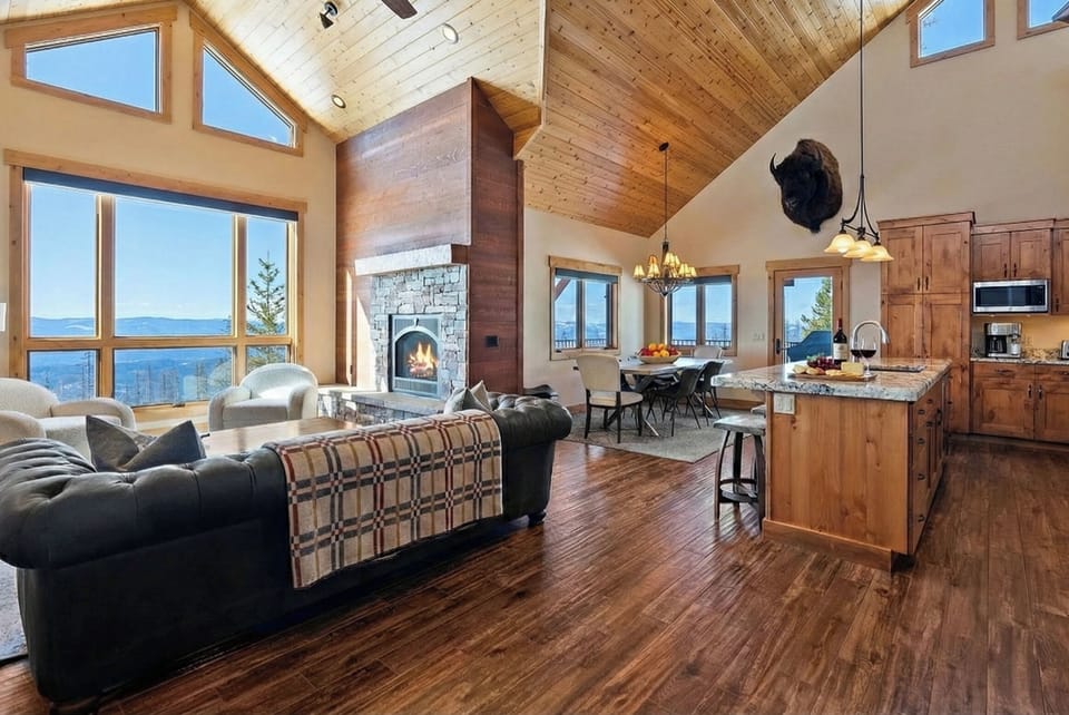 Relax by the fire with Flathead valley views in the vaulted great room.