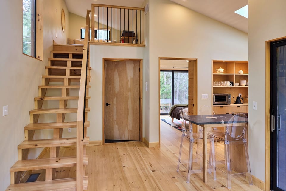 Full sized staircase leading up to the sleeping/relaxing loft. 