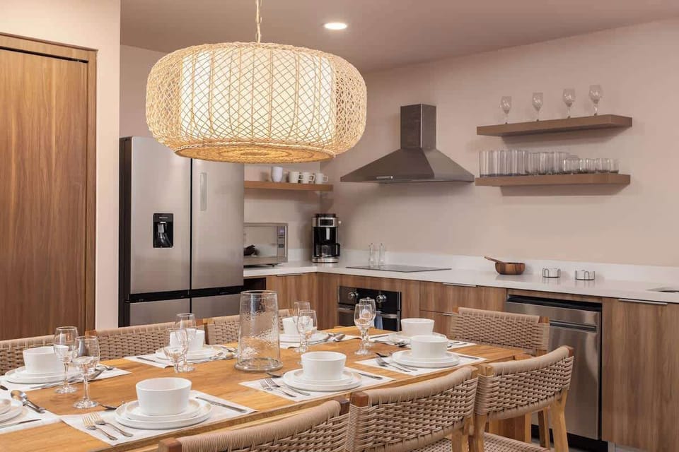 Gather, share, and savor every moment at this beautifully set dining table.